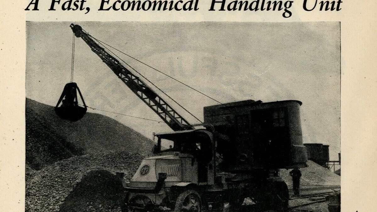 Early truck-mounted crane working with a bucket attachment